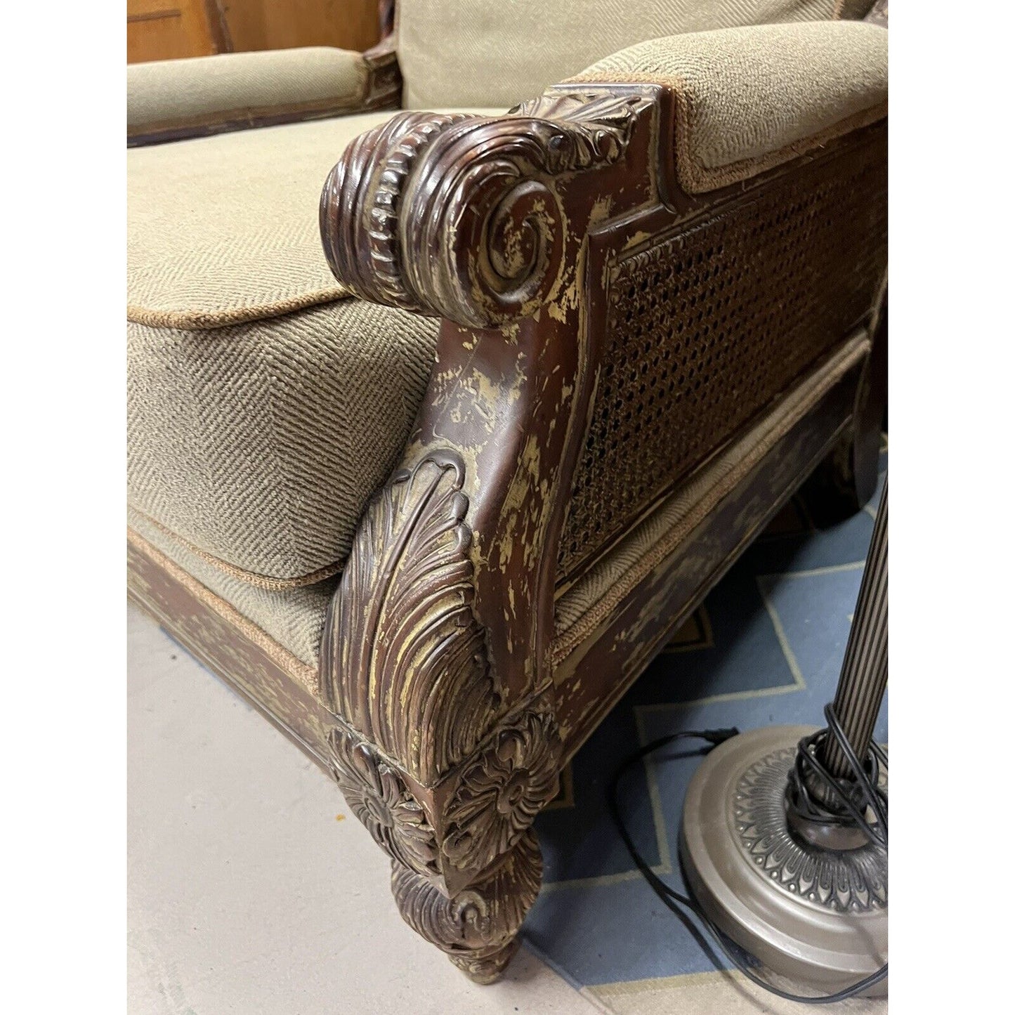 Oversized Upholstered Arm Chair Rustic Acanthus Motif With Cane Sides And Back