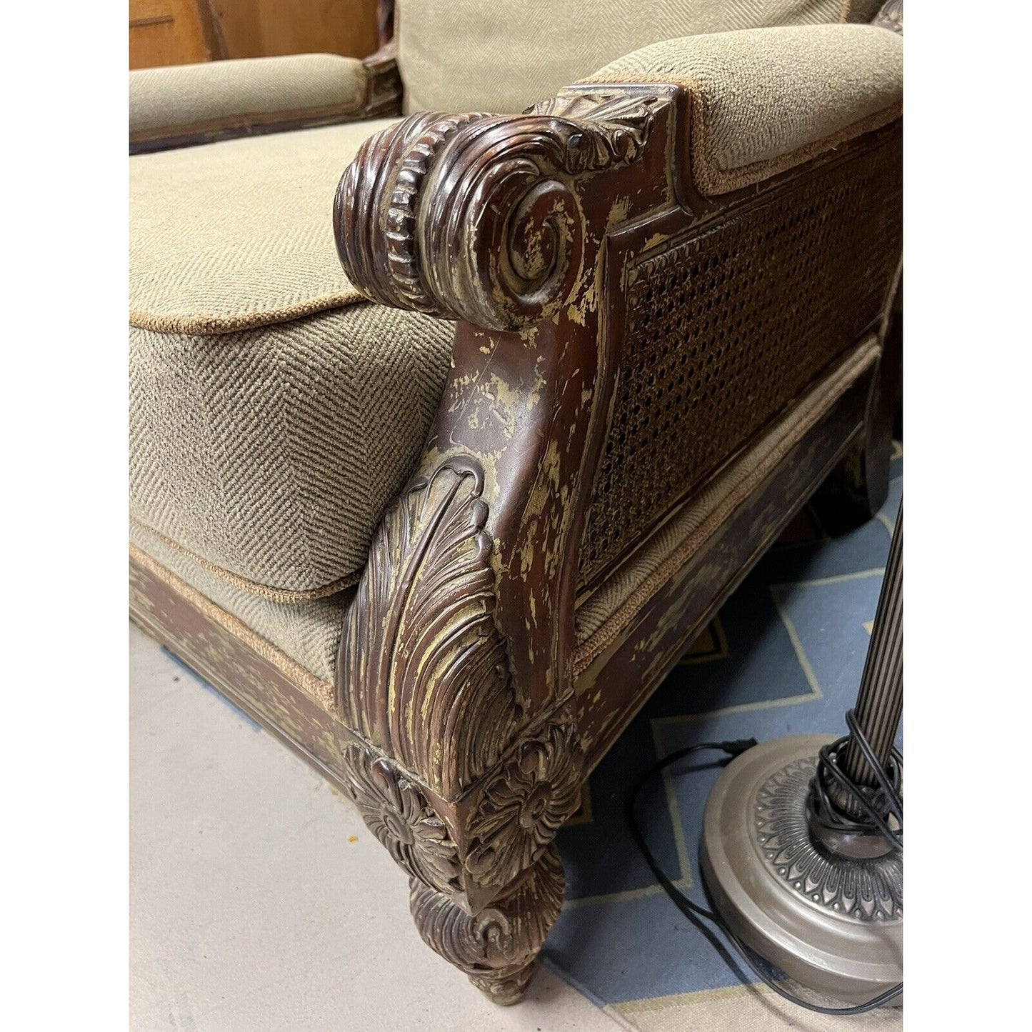 Oversized Upholstered Arm Chair Rustic Acanthus Motif With Cane Sides And Back